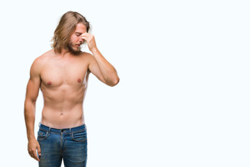Young handsome shirtless man with long hair showing sexy body over isolated background tired rubbing nose and eyes feeling fatigue and headache. Stress and frustration concept.