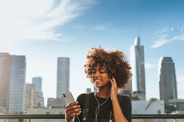 Girl listening to music from her phone