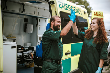 Paramedics at work with an ambulance