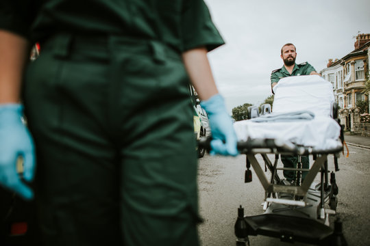 Paramedic Team Rolling A Stretcher On A Street