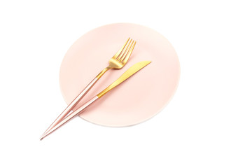 Pink plate and cutlery isolated