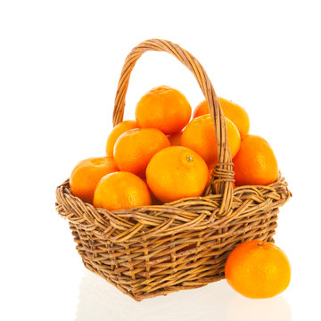 Wicker basket full with clementines