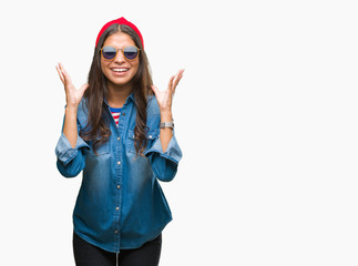 Young beautiful arab woman wearing sunglasses over isolated background celebrating mad and crazy...