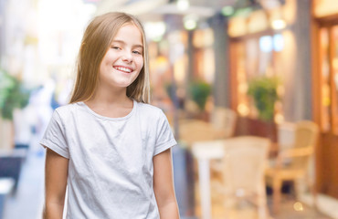 Young beautiful girl over isolated background smiling looking side and staring away thinking.