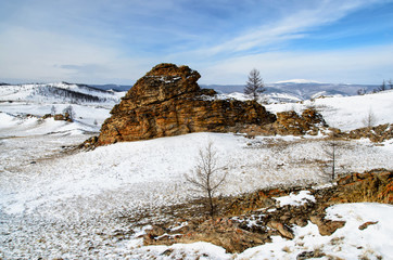 Winter mountain snow valley landscape. Bright high sun above winter snow mountain valley panorama. Siberia landscape