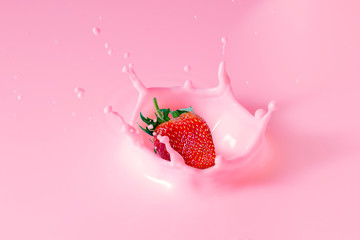 falling strawberry is splashing into milk - Powered by Adobe