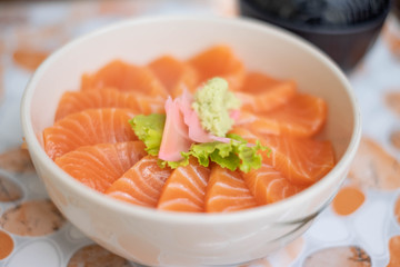 Salmon don - Bowl of steamed rice with salmon sashmi, Japanese traditional food.