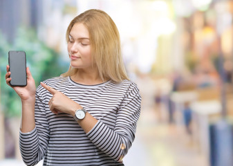 Young caucasian doctor woman wearing surgeon uniform over isolated background success sign doing positive gesture with hand, thumbs up smiling and happy. Looking at the camera with cheerful expression