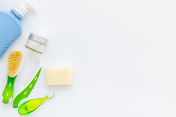 Children's personal care kit. Bath accessories with teeth brush on white background top view copy space