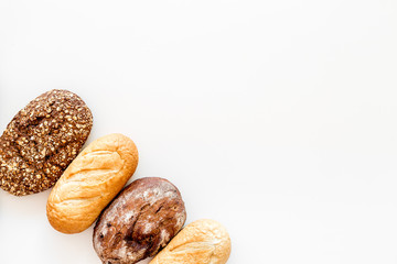 Fresh rustic homemade bread on white background top view space for text