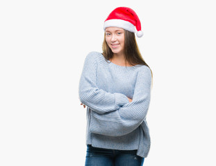 Young beautiful caucasian woman wearing christmas hat over isolated background happy face smiling with crossed arms looking at the camera. Positive person.