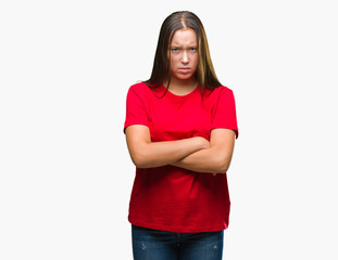 Young beautiful caucasian woman over isolated background skeptic and nervous, disapproving expression on face with crossed arms. Negative person.
