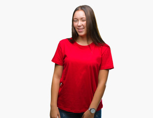 Young beautiful caucasian woman over isolated background winking looking at the camera with sexy...