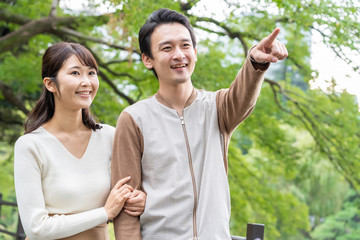 young asian couple in park