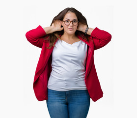 Beautiful plus size young business woman wearing elegant jacket and glasses over isolated background Trying to hear both hands on ear gesture, curious for gossip. Hearing problem, deaf