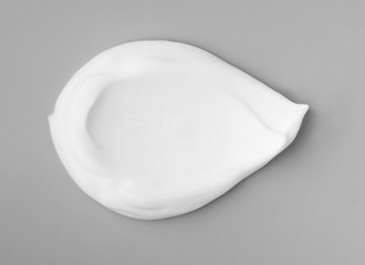 White foam on gray background top view object beatuy health care concept design