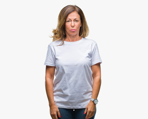Fototapeta premium Middle age senior hispanic woman over isolated background depressed and worry for distress, crying angry and afraid. Sad expression.