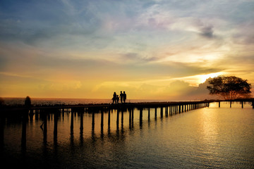 Fototapeta na wymiar Clouse up sea sunset with long bridge