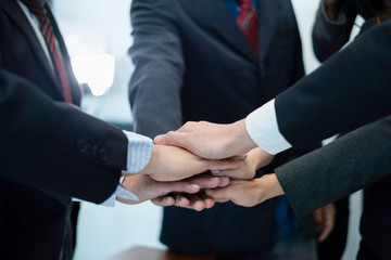 business people put their hands together.businesspeople celebrating in office success deal business, business concept, business success concept