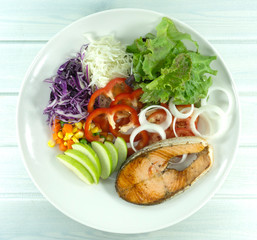Salmon Salad in Plate on wood floor background, Healthy salad diet food concept, Top view, with copy space for your text...