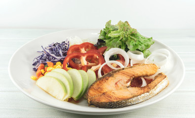 Salmon Salad in Plate on wood floor background, Healthy salad diet food concept, Top view, with copy space for your text..