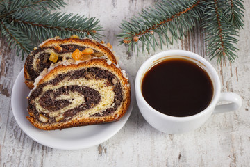 Poppy seeds cake, cup of coffee and spruce branches, dessert and decoration for Christmas