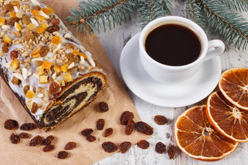 Poppy seeds cake, cup of coffee and spruce branches, dessert for Christmas concept