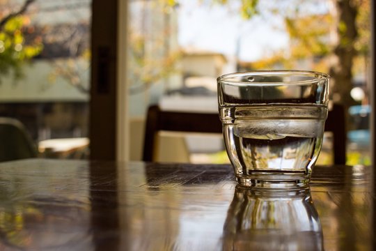 Autumn scene; A glass of water sitting on the table of a restaurant in Ashiya, Japan.