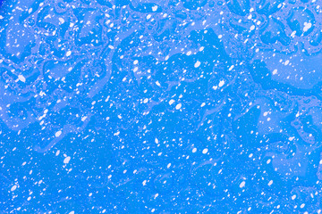 Water drop on green and white dot