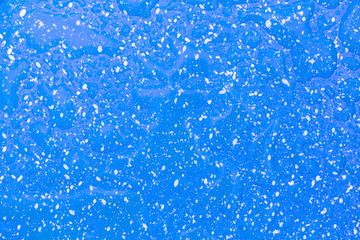 Water drop on green and white dot