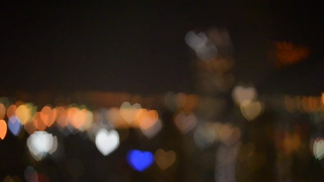 HD footage background of blinking love shape bokeh of bangkok city light.