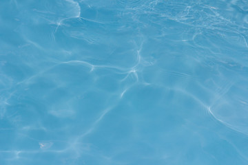 Fototapeta na wymiar Blue pool water texture reflection background