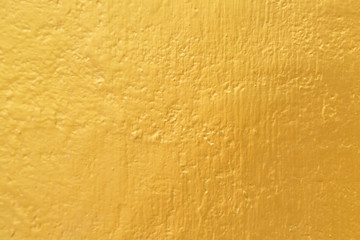 Gold paint on cement wall texture