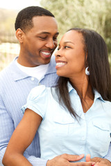Portrait of a Happy African American couple smiling and hugging.