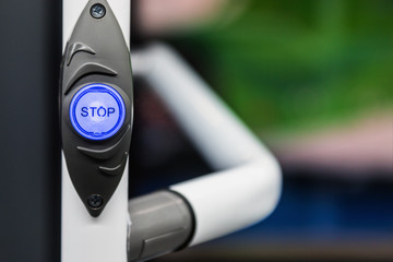 stop button modern and comfortable interior of the city bus. There is a dedicated Braille