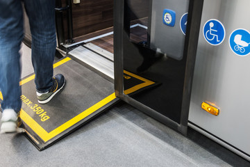 platform for wheelchairs in the cabin of a modern and comfortable city bus or electric bus.