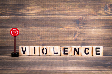 Violence Name from wooden letters with  road sign on wooden background