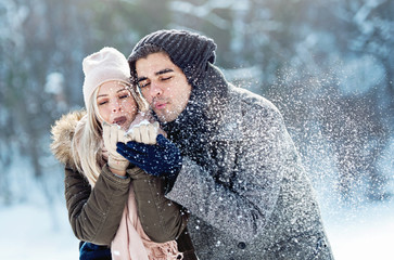 Two young people enjoying in the snow