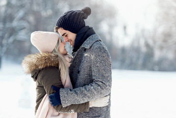 Two young people enjoying in the snow
