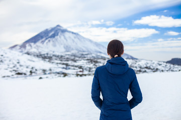 Fototapeta na wymiar Back view of traveler woman enjoy snow mountains