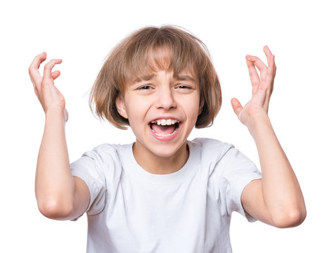 Sad attractive caucasian girl, isolated on white background. Unhappy or frustrated and angry schoolgirl screaming. Child in white t-shirt - emotional portrait close-up.