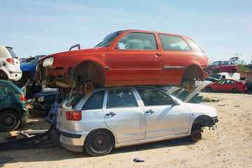 A graveyard of cars, broken cars sell on spare parts.	