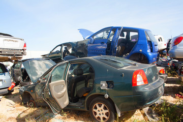 A graveyard of cars, broken cars sell on spare parts.	