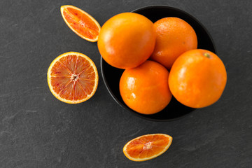food, fruits and healthy eating concept - close up of fresh juicy blood oranges