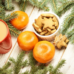 Fototapeta na wymiar Gingerbread Cookie. New Year. Orange tangerines. Spruce branch