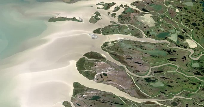 Very high-altitude circular tracking shot of Mackenzie Delta, Canada. Reversible, seamless loop. Elements of this image furnished by NASA