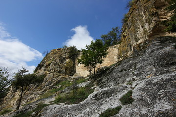 beautiful bottom view of the mountain with clouds