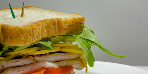 Delectable deli sandwich with toothpicks on top