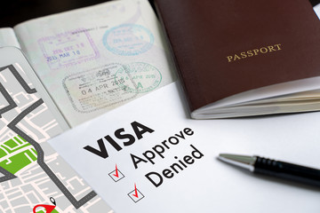 Visa and passport to approved stamped on a document top view in Immigration Visa approve