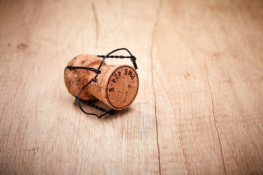 Champagne cork with text on cap